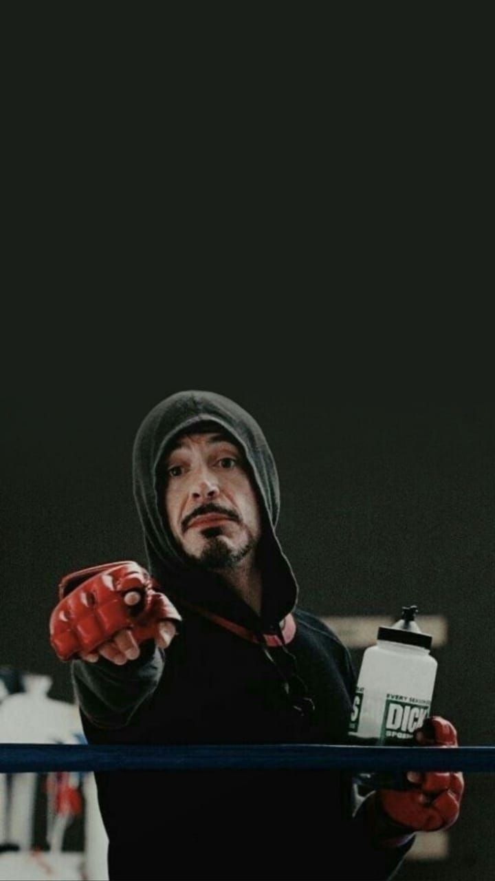 Tony Stark in workshop with arc reactor